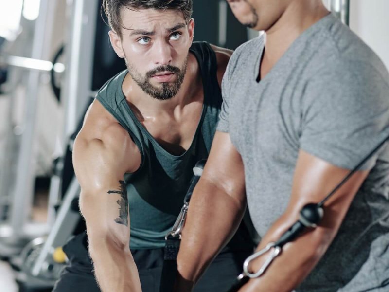 fitness-trainer-controlling-exercising-man.jpg